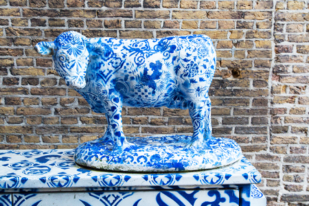 Holland Blue Delft Porcelain cow sculpture in Delft, Netherlandsの写真素材