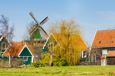 Zaanse Schans, Holland traditional village houses, windmill  against blue skyの写真素材