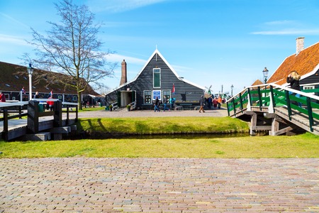 Zaanse schans, Netherlands - April 1, 2016: Delft Blue pottery shop in Zaanse Schans, North Holland, traditional village, touristsのeditorial素材