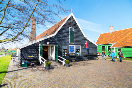 Zaanse schans, Netherlands - April 1, 2016: Delft Blue pottery shop in Zaanse Schans, North Holland, traditional village, touristsのeditorial素材
