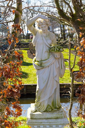 Copy of ancient statue in the garden of Zaanse Schans village, Hollandの写真素材