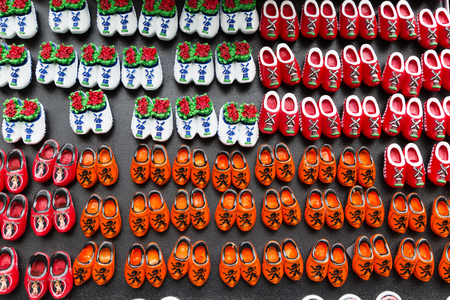 Magnets with dutch traditional wooden shoes or clogs for sale in shop in Netherlandsの写真素材