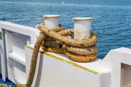 Mooring bollard with a fixed rope on the shipの写真素材