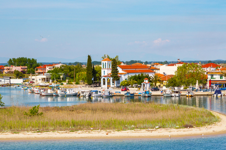Keramoti, Greece - May 1, 2016: Keramoti church and port and town view with ferry boat going to Thassos islandのeditorial素材
