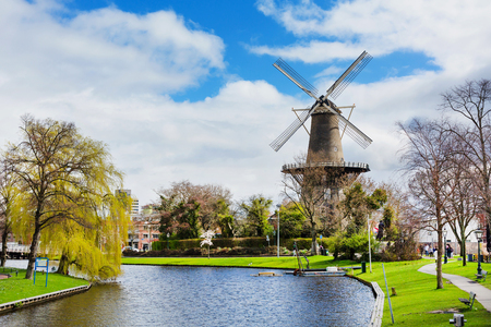 Leiden, Netherlands - April 7, 2016: Windmill de Valk in Leiden, street light and canal, Holland, Netherlands in springのeditorial素材