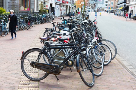 Leiden, Netherlands - April 7, 2016: Many bicyces parked in the street in Holland town Leiden, Netherlandsのeditorial素材