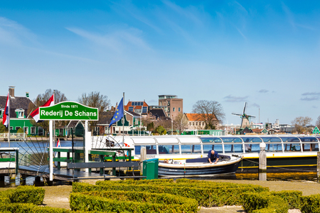 Zaanse schans, Netherlands - April 1, 2016: Panorama with boat pier in Zaanse Schans in Netherlands, Holland near Amsterdamのeditorial素材