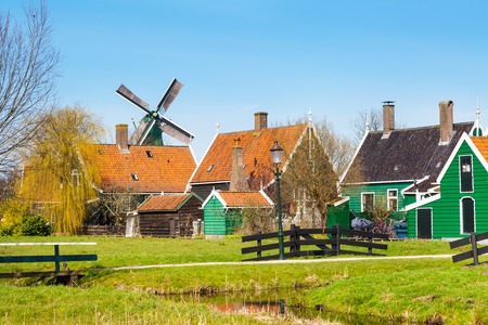 Zaanse Schans, Holland traditional village houses, windmill  against blue skyの写真素材