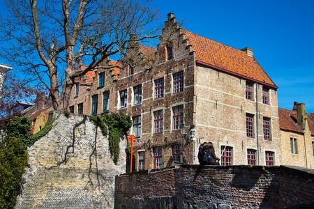 Bruges, Belgium - April 10, 2016: Scenic cityscape with houses, bridge and couple making selfie in Bruges, Belgiumのeditorial素材
