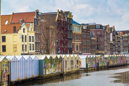 Amsterdam, Netherlands - March 31, 2016: Flower market street view in Amsterdam canal in Hollandのeditorial素材