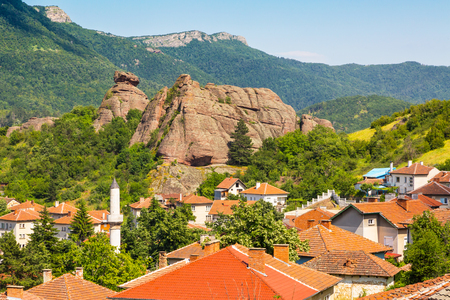 Vibrant image of Belogradchik, Bulgaria town scenery with old houses red roofs and rocksの写真素材