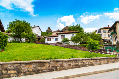 Vibrant image of Belogradchik, Bulgaria town scenery with old houses, rocks and street viewの写真素材