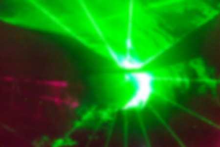 Abstract blur background pattern with space bright green and red laser rays, smoke and flashの写真素材