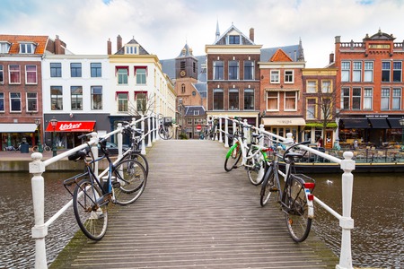 Leiden, Netherlands - April 7, 2016: Traditional houses, bridge and bicycles in downtown of Leiden, Holland, Netherlandsのeditorial素材