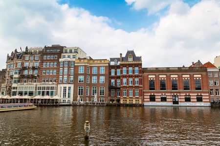 Amsterdam, Netherlands - April 2, 2016: Traditional old buildings, canal view in Amsterdam, Netherlandsのeditorial素材