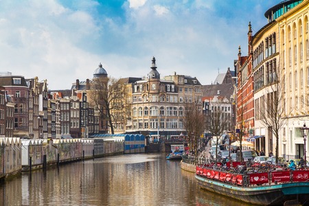 Amsterdam, Netherlands - March 31, 2016: Boat and flower market street view in Amsterdam canal in Hollandのeditorial素材