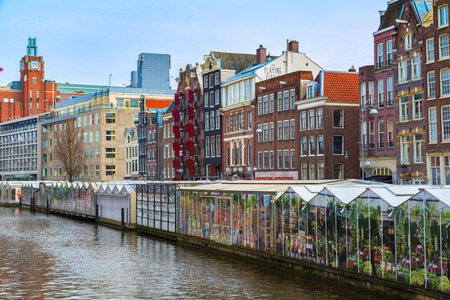 Amsterdam, Netherlands - March 31, 2016: Flower market street view in Amsterdam canal in Hollandのeditorial素材