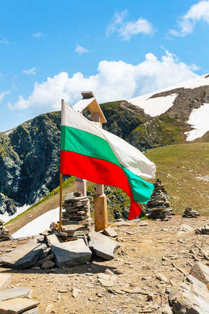 Bulgarian flag at the peak near Seven Rila Lakes in National Park Rila, Bulgariaの写真素材