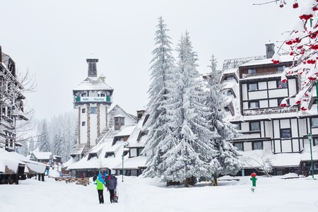 Kopaonik, Serbia - January 18, 2016: Street of ski resort Kopaonik, Serbia after snowfall, people, snowy trees at winter timeのeditorial素材