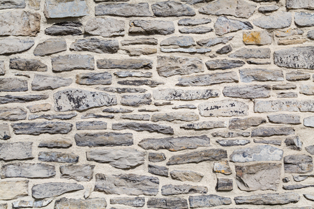 Grunge background of vintage gray stone brick wall texture photoの写真素材