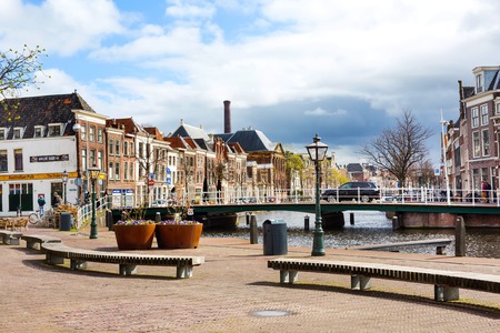 Leiden, Netherlands - April 7, 2016: Traditional houses, bridge and people in Leiden, Hollandのeditorial素材