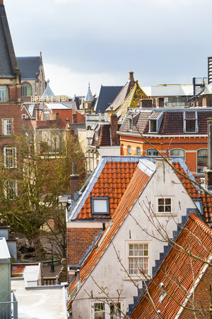 Town aerial view with traditional houses and red roofs in Leiden, Netherlandsの写真素材