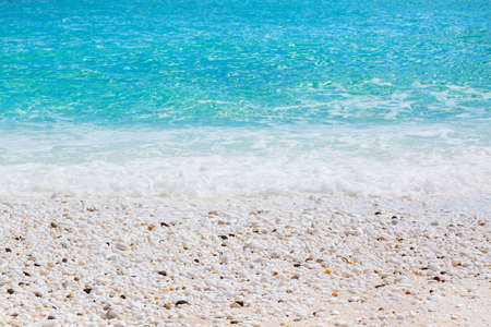 Summer vacation background texture of Saliara aka Marble Beach stones and waves in Thassos Island, Greece and turquoise water waveの写真素材