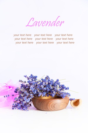Making aroma bags, bunch of dry wild mountain lavender flowers and wooden bowlの写真素材