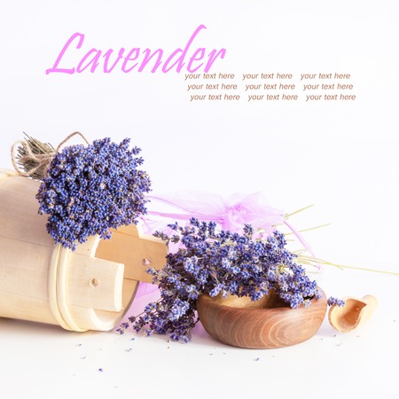 Making aroma bags, bunch of dry wild mountain lavender flowers and wooden bowlの写真素材