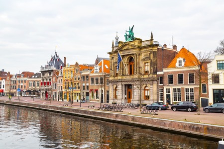 Haarlem, Netherlands - April 2, 2016: Picturesque landscape with beautiful traditional houses reflection in canal, Haarlem, Hollandのeditorial素材