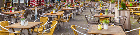 Panoramic background with European street cafe or restaurant tablesの写真素材