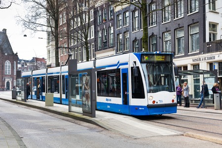 Amsterdam, Netherlands - March 31, 2016: Tram 1 running in city centre to Central Station, Amsterdamのeditorial素材
