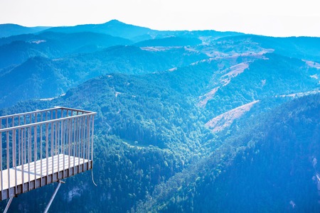 Background with Rhodope or Rodopi mountains in Bulgaria and Eagle Eye viewpoint up on the rock. Bulgarian name Orlovo Okoの写真素材