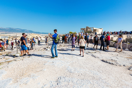 Athens, Greece - October 14, 2016: Tourists taking photos near temple ruins in Acropolis, Athensのeditorial素材