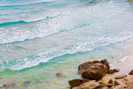 Summer beach vacation background with turquoise sea water waves