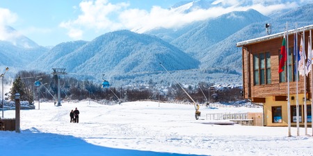 Bansko, Bulgaria - November 30, 2016: Bansko ski resort panorama with cable car ski lift cabin and snow mountainsのeditorial素材