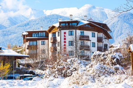 Bansko, Bulgaria - November 30, 2016: Elegant Lux hotel and snow mountains panorama in bulgarian ski resort Banskoのeditorial素材