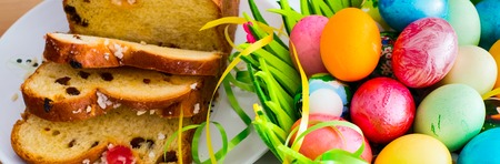 Easter banner background with colorful Easter eggs and traditional Easter cake