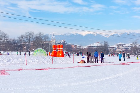 Bansko, Bulgaria - January 13, 2017: Winter ski resort Bansko, attractions, people walking and skiing and mountains viewのeditorial素材