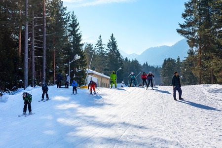 Bansko, Bulgaria - January 13, 2017: Winter ski resort Bansko, ski slope, people skiing and mountains viewのeditorial素材
