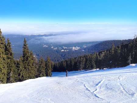 Aerial panorama of winter town houses, ski slopes in bulgarian alpine ski resort Borovetsの写真素材
