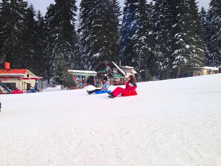 Borovets, Bulgaria - January 30, 2017: People sledging at ski resort Borovetsのeditorial素材