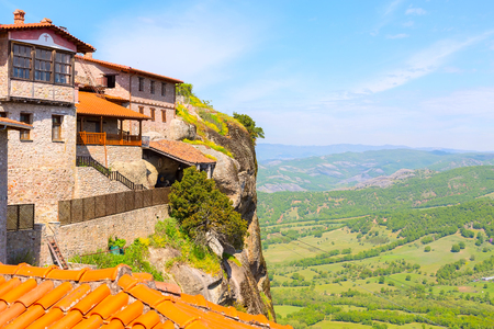 Meteora monastery on the high rock and aerial view of the mountains and valley, Greeceの写真素材