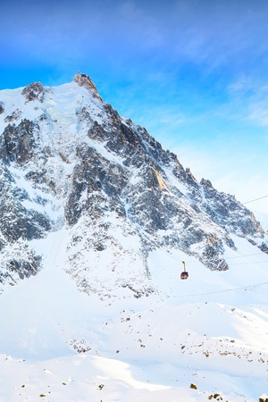 The mountain top station of the Aiguille du Midi in Chamonix mont blanc, France and cable carの写真素材