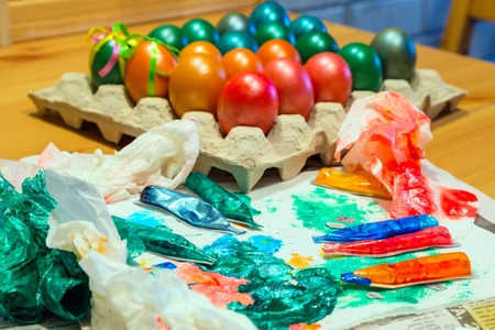 Easter preparation with colorful used dyes creativity backgroundの写真素材