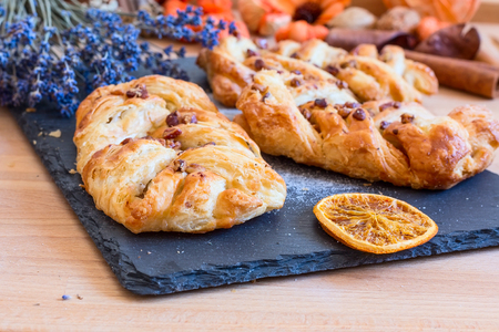 marple and pecan plait pastry sweet food breakfast with lavender flowersの写真素材