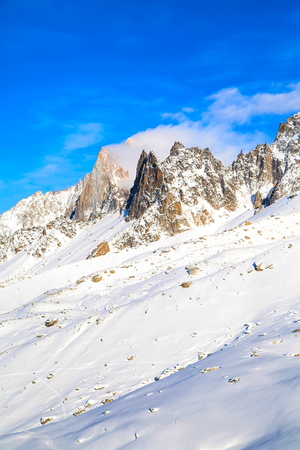 white snow mountain landscape and blue sky in french alpsの写真素材