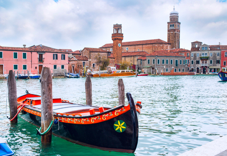 Romantic Venice scenery with gondola boat, venetian houses and canal view, Italyの写真素材