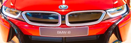 Munich, Germany - December 28, 2016: Red BMW i8 logo car front view banner backgroundのeditorial素材