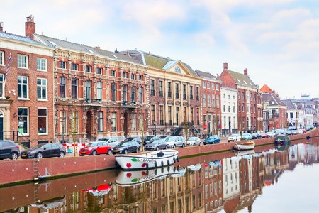 Haarlem, Netherlands - April 2, 2016: Picturesque landscape with beautiful traditional houses reflection in canal, Haarlem, Hollandのeditorial素材